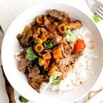 Pinterest Pin for Slow Cooker Picadillo Pot Roast with text overlay.