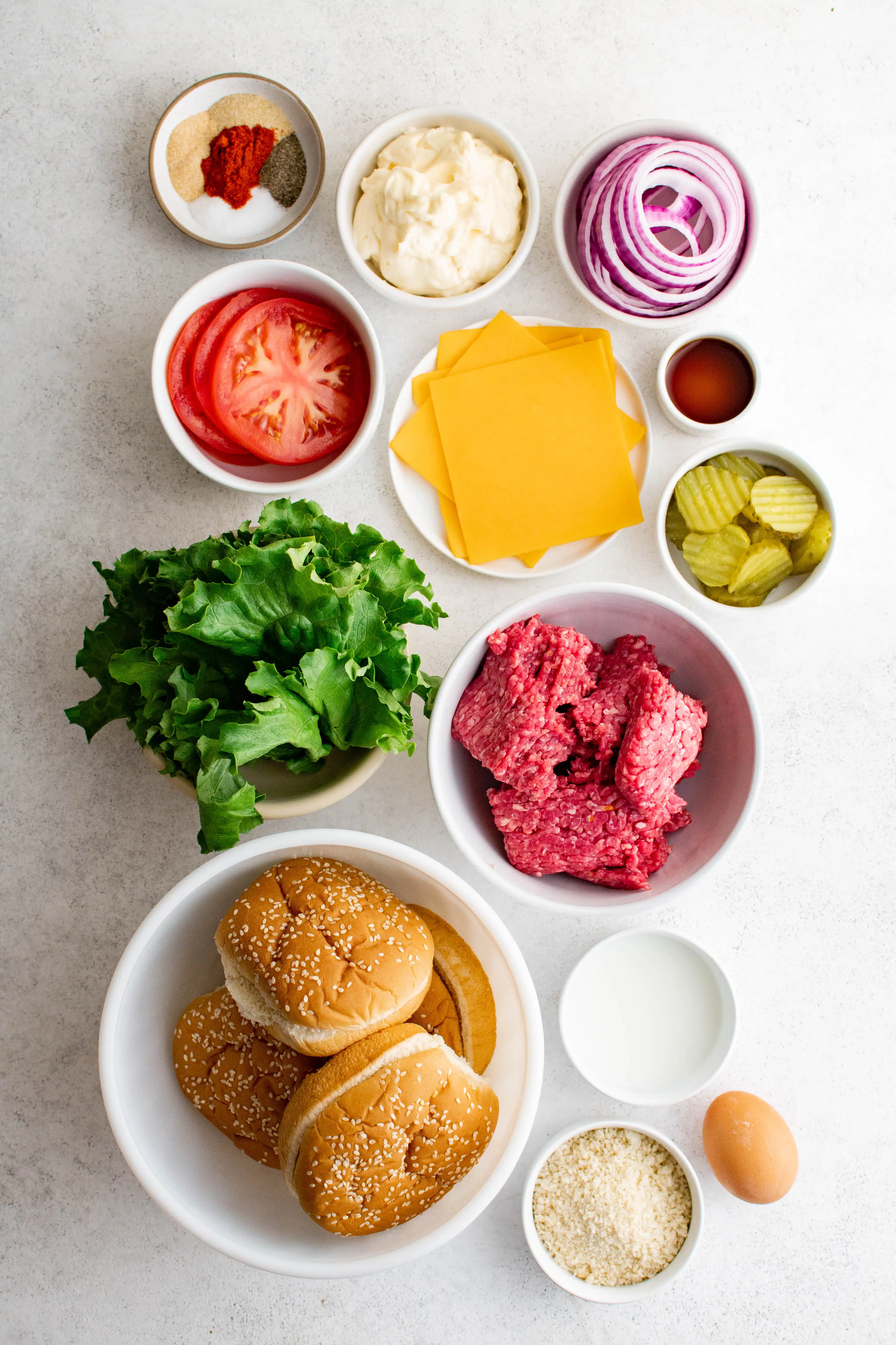 All of the ingredients to make the best hamburgers recipe plus the buns and toppings.