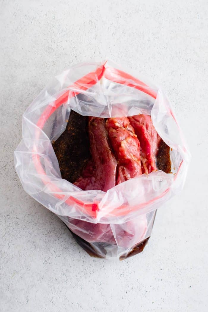 Pork tenderloin and marinade in a large ziplock bag.
