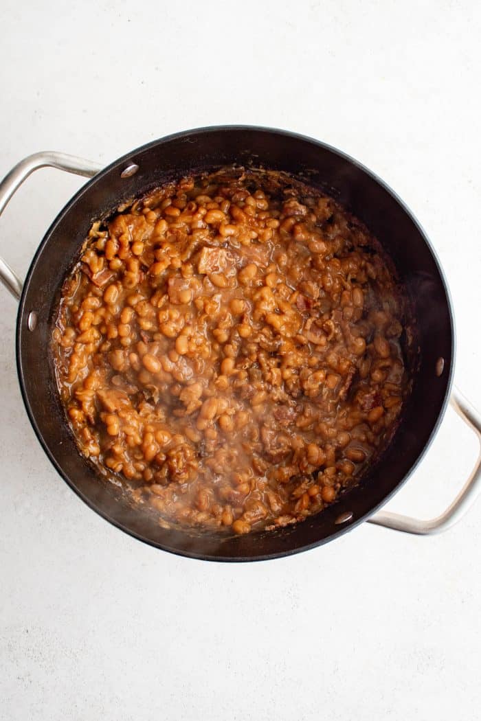 Oven-baked Boston baked beans in a large pot.