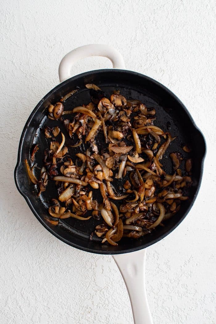 Caramelized onions and mushrooms in a large skillet.