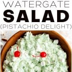 This vertical Pinterest collage features three sections: the top left shows small bowls with the classic Watergate Salad ingredientsโcrushed pineapple, marshmallows, whipped topping, pistachio pudding mix, and chopped nuts. The top right image is a single serving of the fluffy, pale green salad garnished with a bright red maraschino cherry in a white ramekin. The main image on the bottom displays a large wooden bowl filled with the pistachio-flavored salad, garnished with mini marshmallows and maraschino cherries, and a large spoon ready to serve. The text overlay reads โWatergate Salad (Pistachio Delight).โ Perfect for holidays or potlucks.