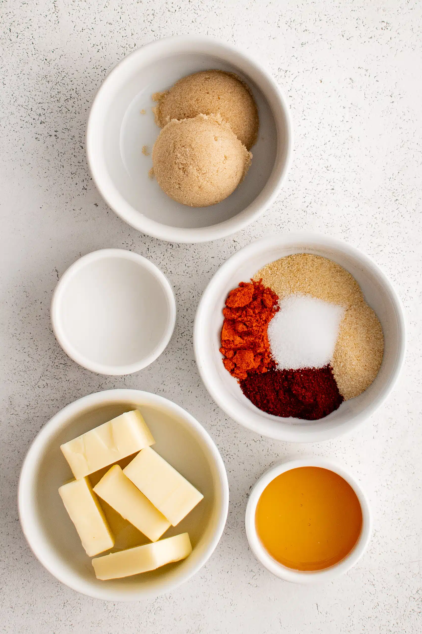 Ingredients needed to make Nashville Hot Sauce in individual measuring cups and ramekins.