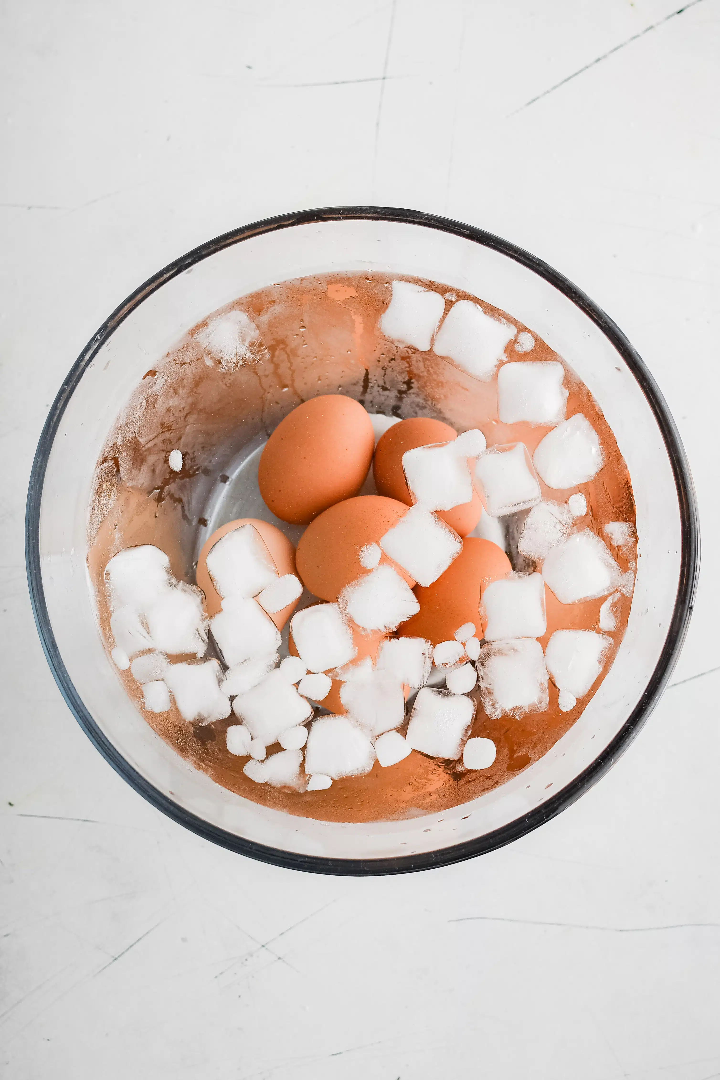 Ice water bath filled with hard-boiled eggs.