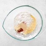 Excess flour combined with the cornmeal, garlic powder, onion powder, salt, pepper, and paprika.