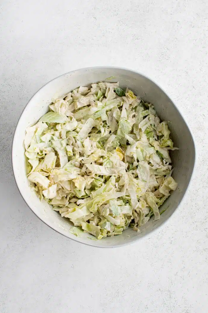 Fresh and crisp shredded iceberg lettuce coated in homemade creamy mayo dressing.
