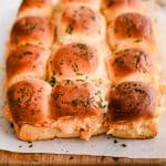 One dozen baked buffalo chicken sliders made with shredded chicken mixed in creamy buffalo sauce, and shredded mozzarella cheese.