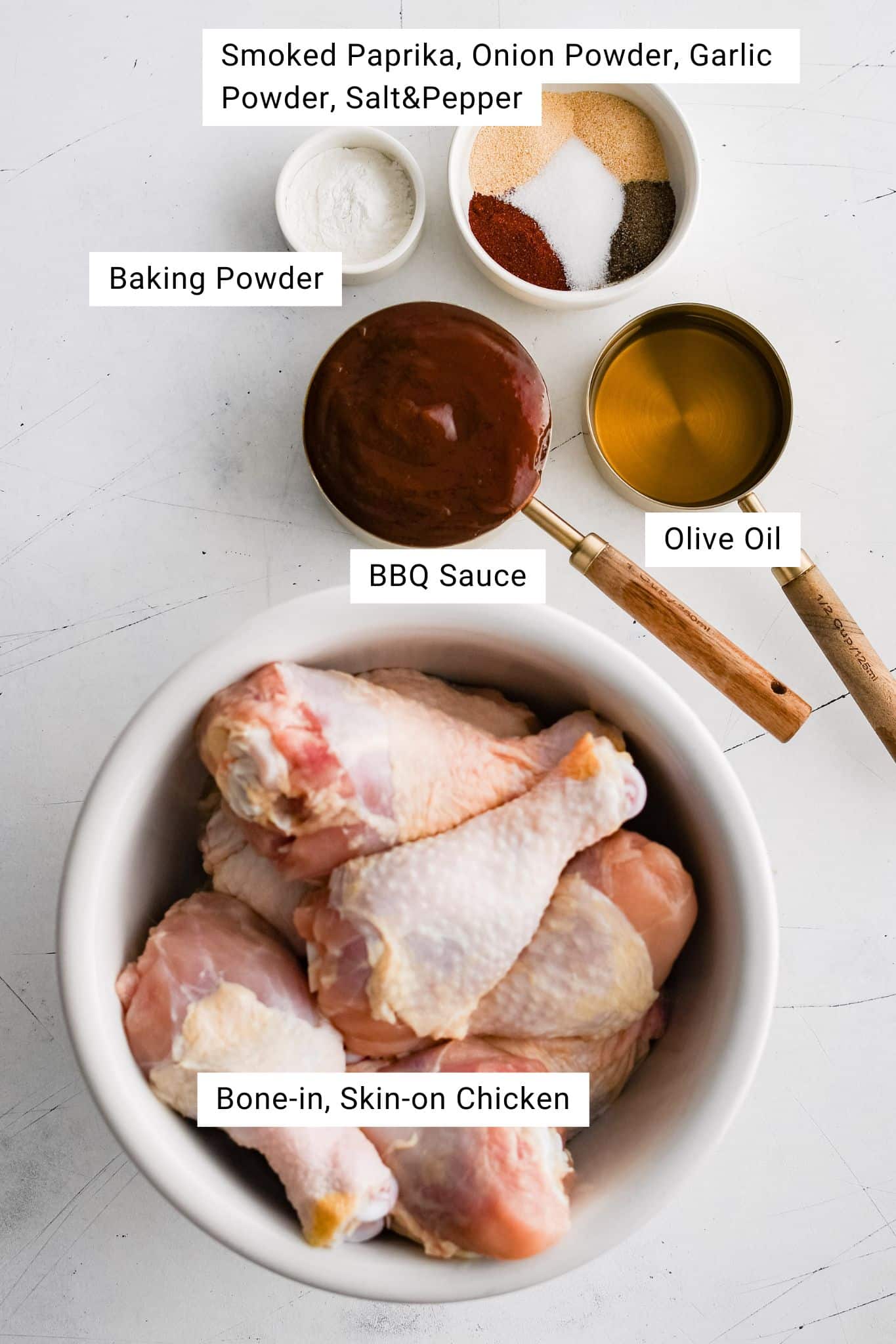 All of the ingredients for Baked BBQ Chicken presented in individual measuring cups and ramekins.
