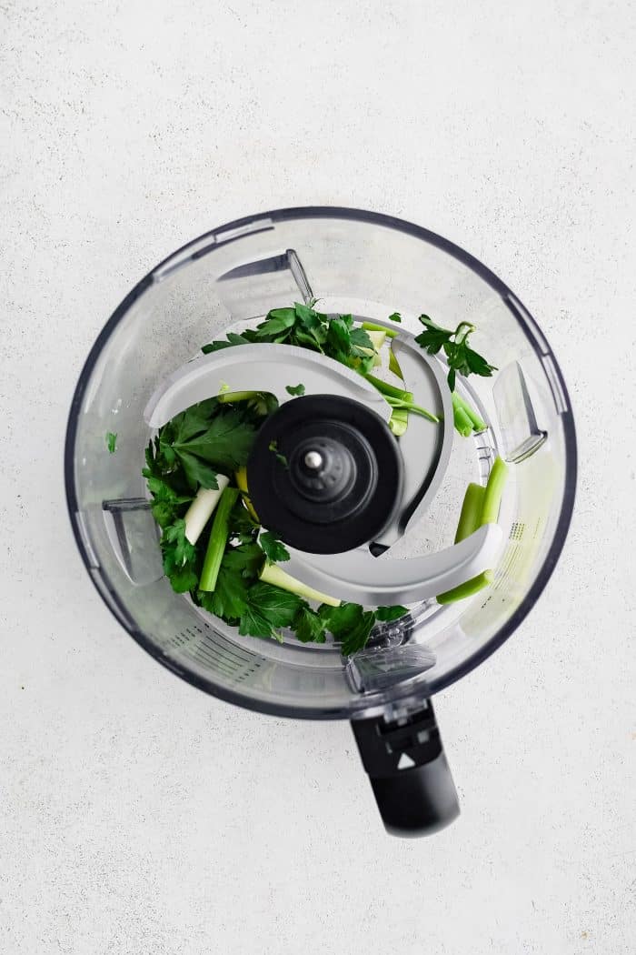 One bunch of green onions and one bunch of fresh parsley in a small food processor.