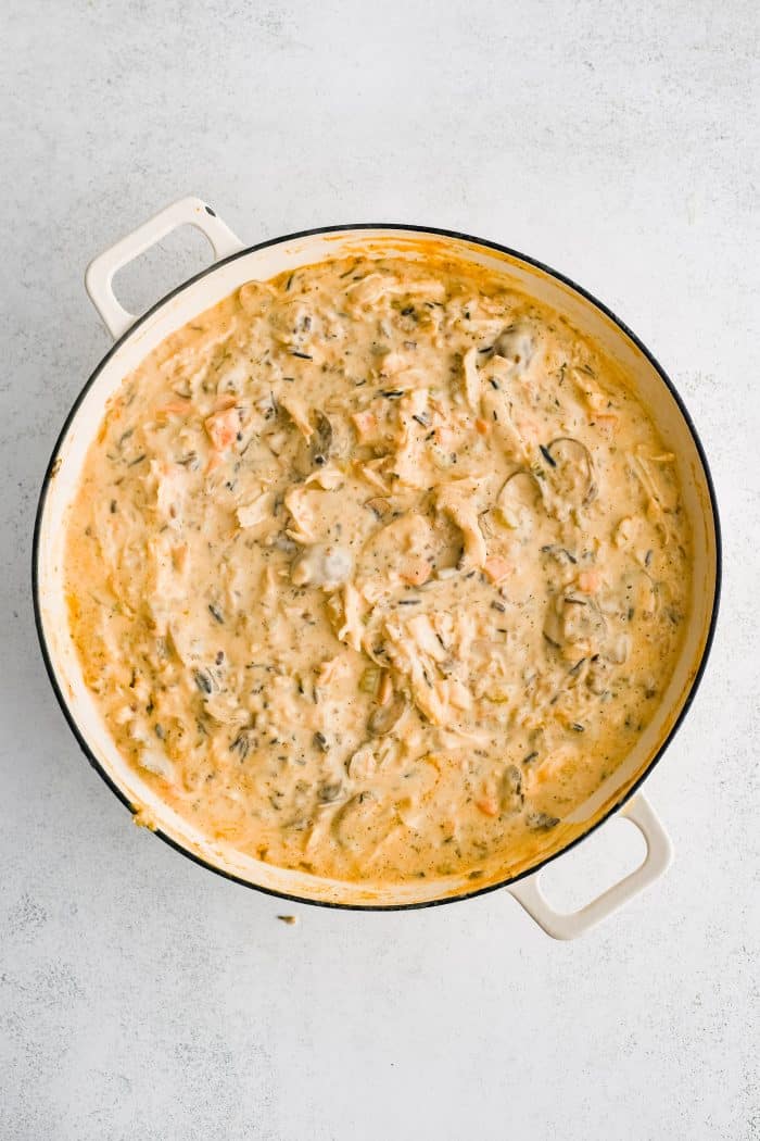 Thickened cream and cheese sauce with softened celery, onion, mushroom, carrots, shredded chicken, and wild rice blend.