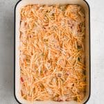 An even layer of shredded Colby Jack cheese sprinkled over an even layer of creamy, chicken-filled cheese sauce.