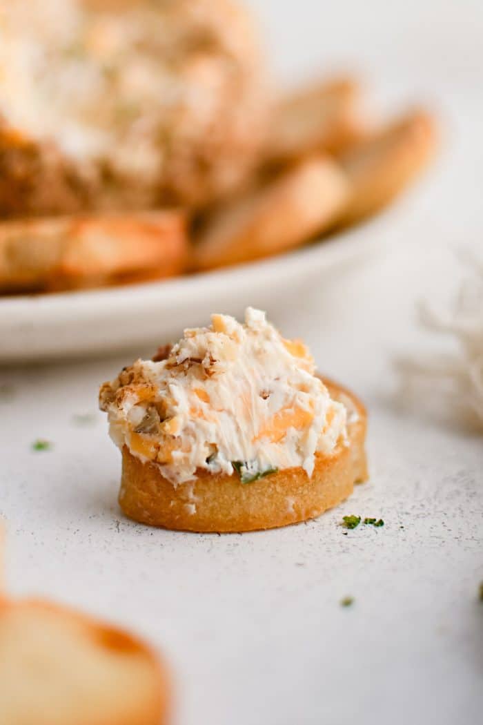 A small crostini spread with classic cheese ball mixture.