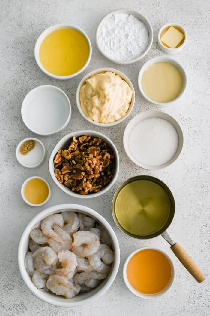 All of the ingredients needed to make Honey Walnut Shrimp in individual measuring cups and ramekins.