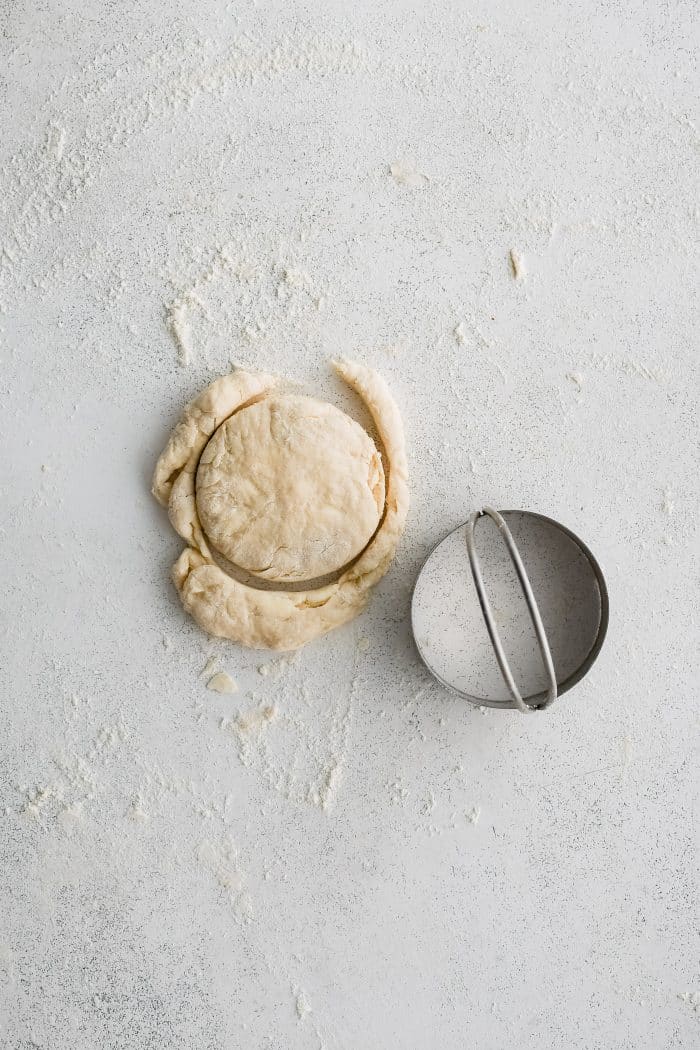 One biscuit cut from a small 1/2-inch thick circle of biscuit dough.