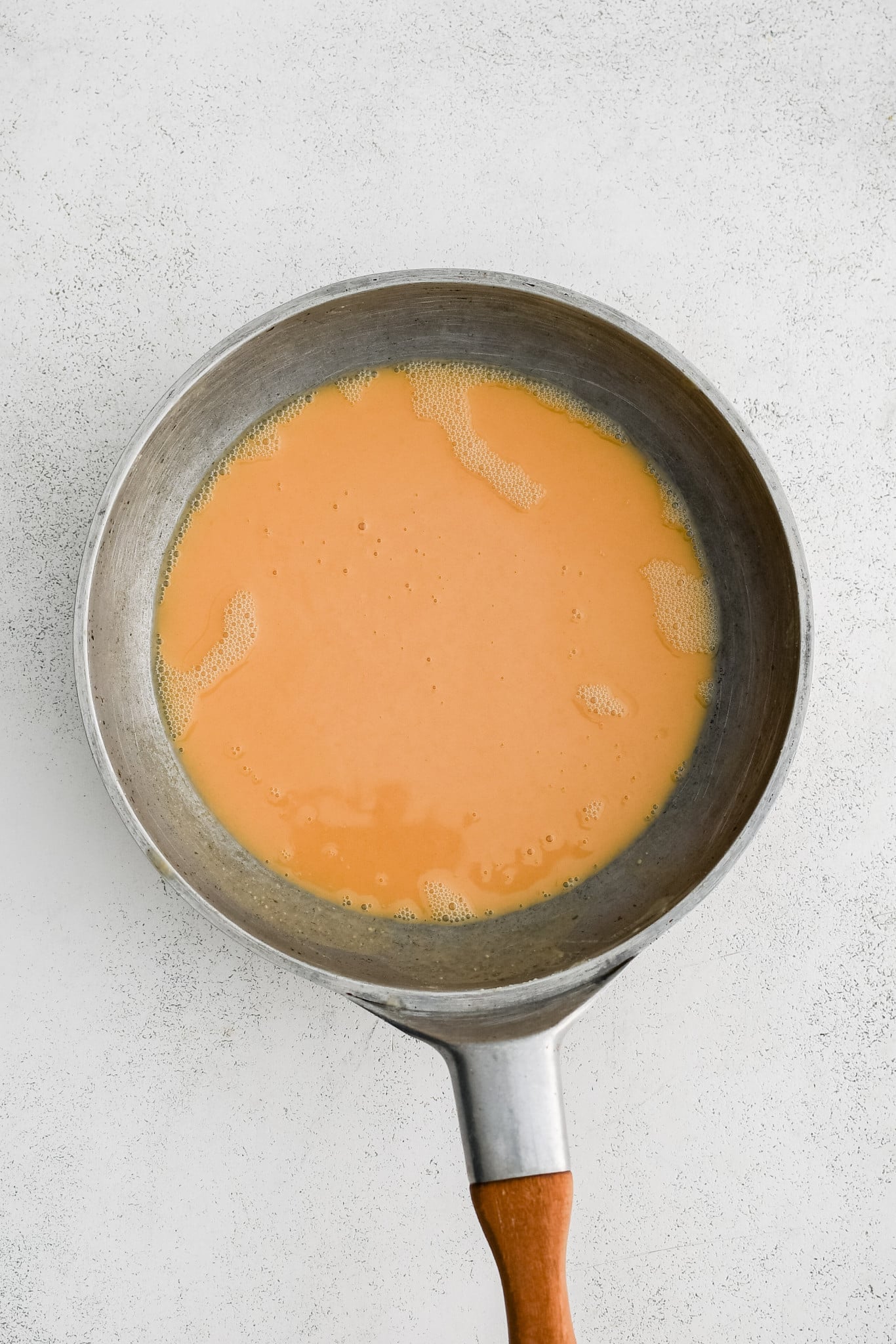 A brown roux in a large stainless steel skillet.