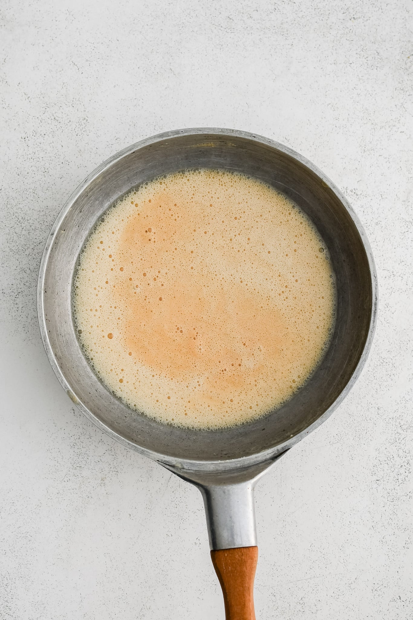 A blonde roux in a large stainless steel skillet.