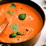 Pinterest Pin for creamy tomato bisque soup recipe with text overlay.