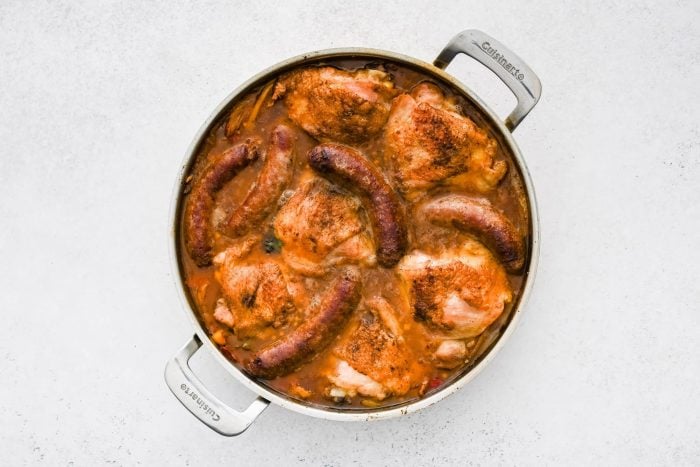 Skillet filled with Chicken Scarpariello just out of the oven.