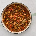 Large skillet filled with homemade Mexican-style picadillo.