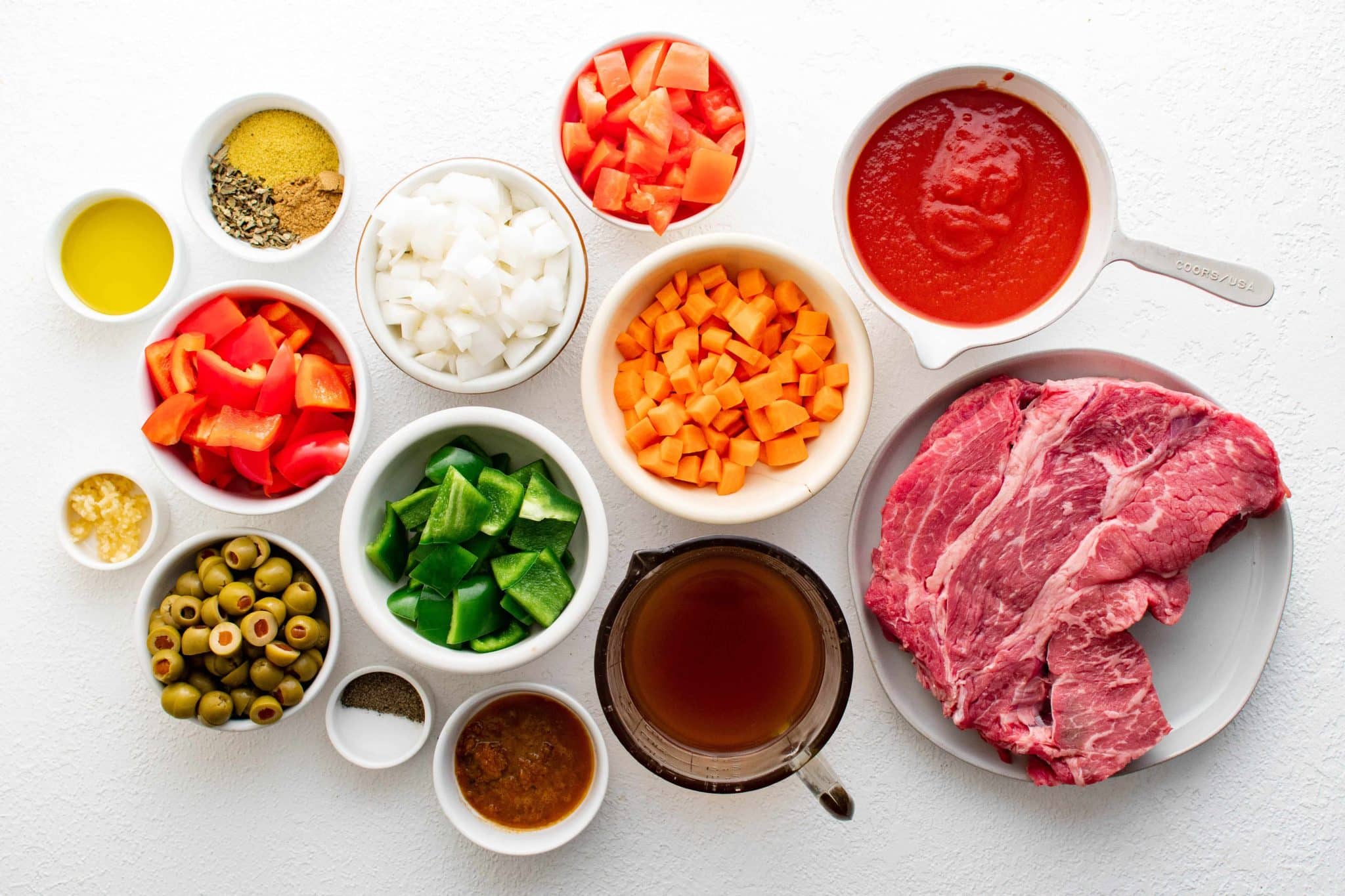 All of the ingredients needed to make Slow Cooker Picadillo Pot Roast.