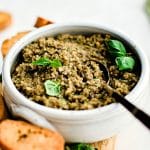 Pinterest Pin Image for olive tapenade recipe with one image and text overlay.