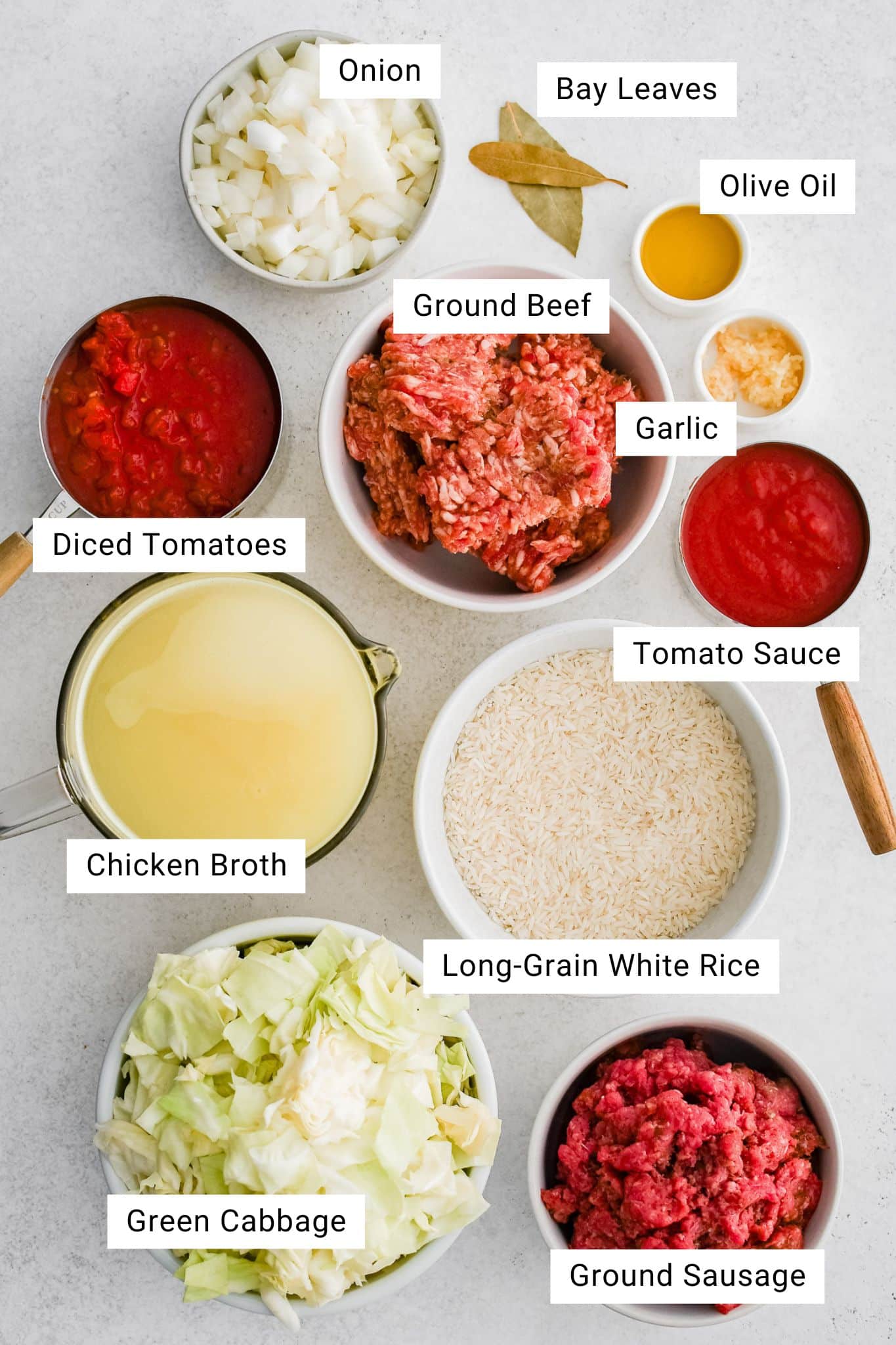 Ingredients for a Cabbage Roll Soup Recipe were measured and set aside in individual serving bowls.