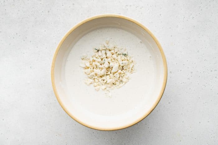 Crumbled blue cheese added to the creamy dressing base.