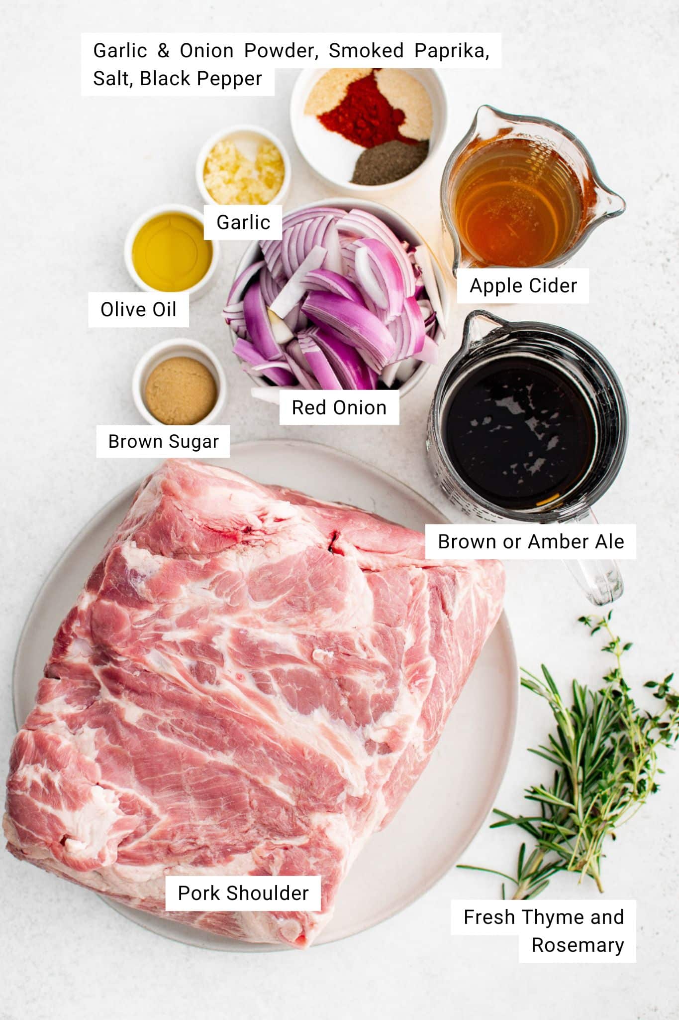 Individual ingredients for braised pork shoulder neatly arranged in small bowls on a clean surface.