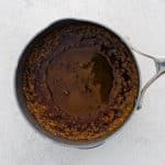 Honey has been added to the spiced butter mixture, and it’s now a rich amber color, gently simmering.