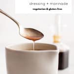 Spoon drizzling balsamic vinaigrette into a small white bowl with text overlay “Balsamic Vinaigrette – dressing + marinade – vegetarian & gluten-free”