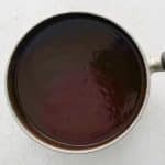 Smooth mumbo sauce simmering in a saucepan
