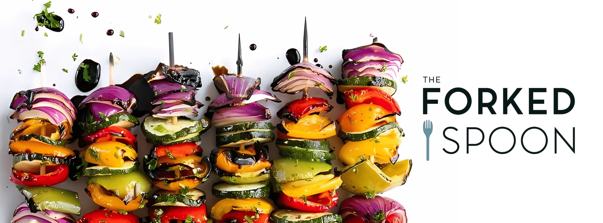 assorted vegetable skewers with glossy bell peppers, red onion, and zucchini on a white backdrop. To the right is the logo "The Forked Spoon” with a blue spork.