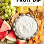A top-down photo of a bowl of cream cheese fruit dip on a platter of watermelon, grapes, cantaloupe, pineapple, and graham crackers, with a title box overlay that reads "cream cheese FRUIT DIP just 5-ingredients."
