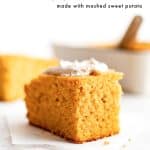 A Pinterest recipe pin with a large image of a slice of golden sweet potato cornbread topped with cinnamon butter. Text at the top reads "Sweet Potato Cornbread made with mashed sweet potato". A baking dish is visible blurred in the background.