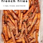 Tray of golden French fries sprinkled with seasoning, text overlay โThe secret to crispy French fries + tips, tricks, and more!โ