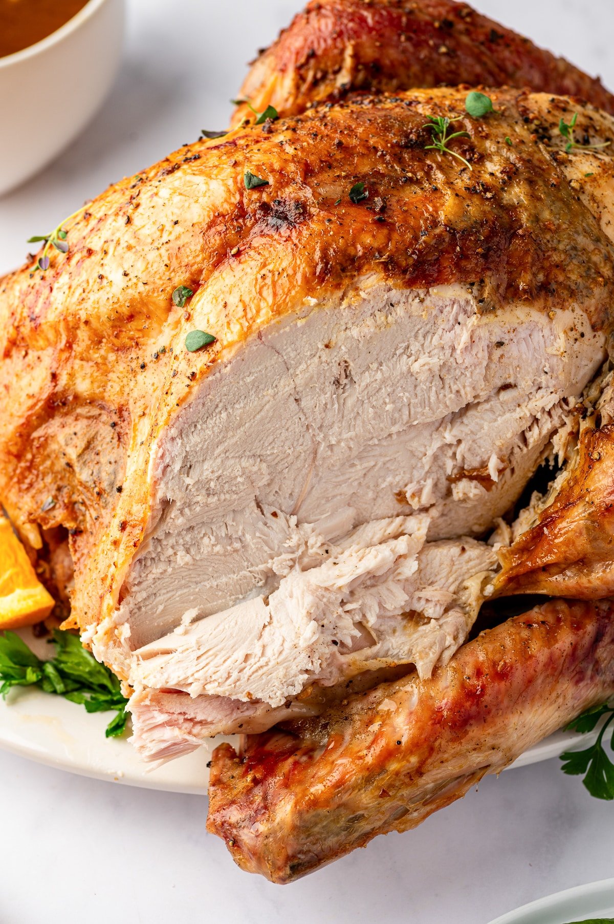 Sliced roasted turkey breast showing juicy tender meat for Thanksgiving dinner