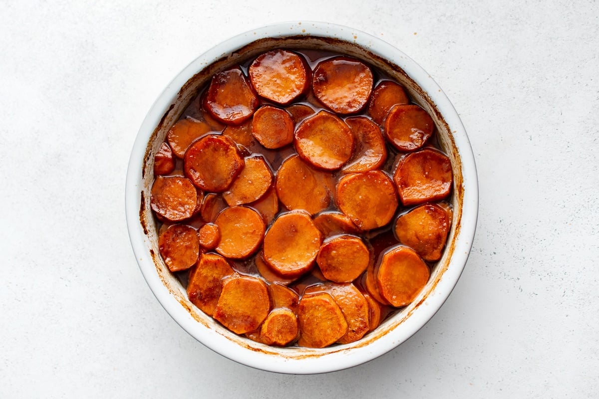 Fully baked candied yams in a thick, glossy syrup.