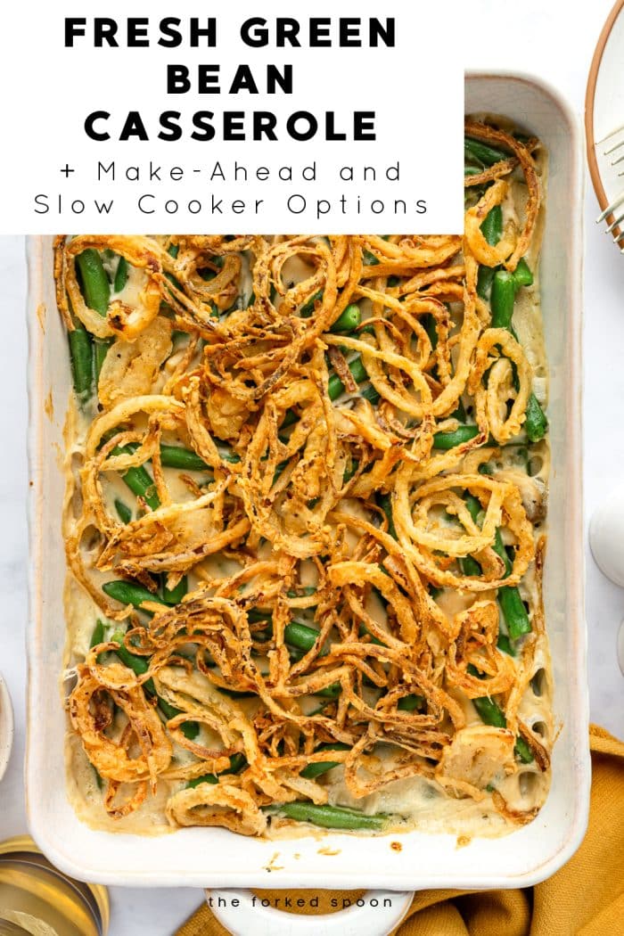 Fresh green bean casserole baked with crispy fried onions, shown in a white baking dish.