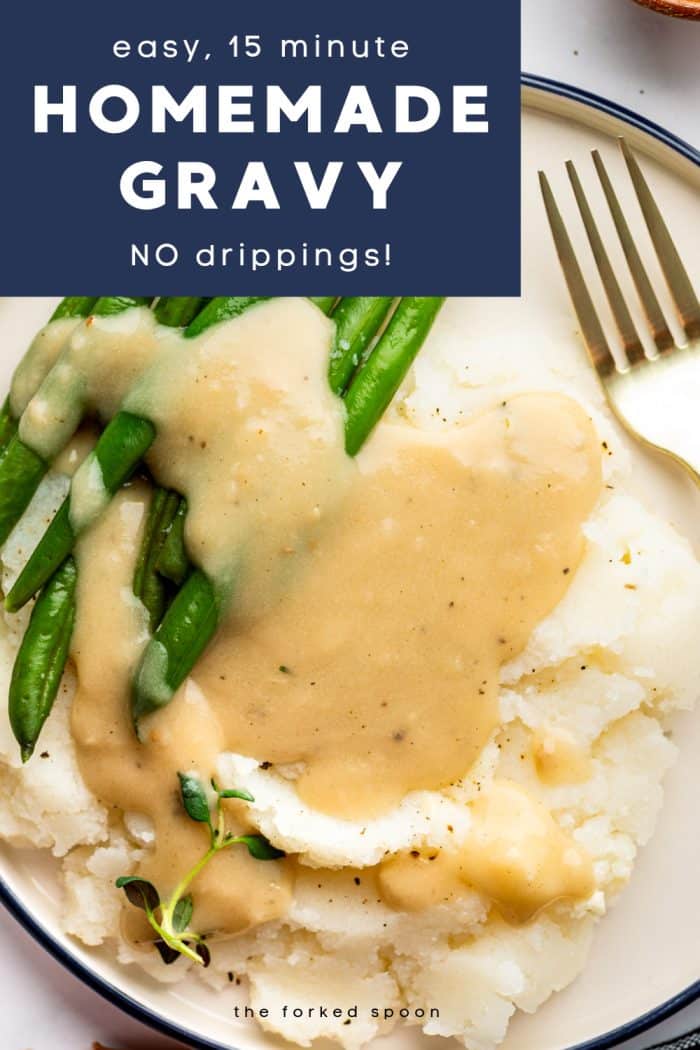 Plate of mashed potatoes and green beans topped with creamy homemade gravy