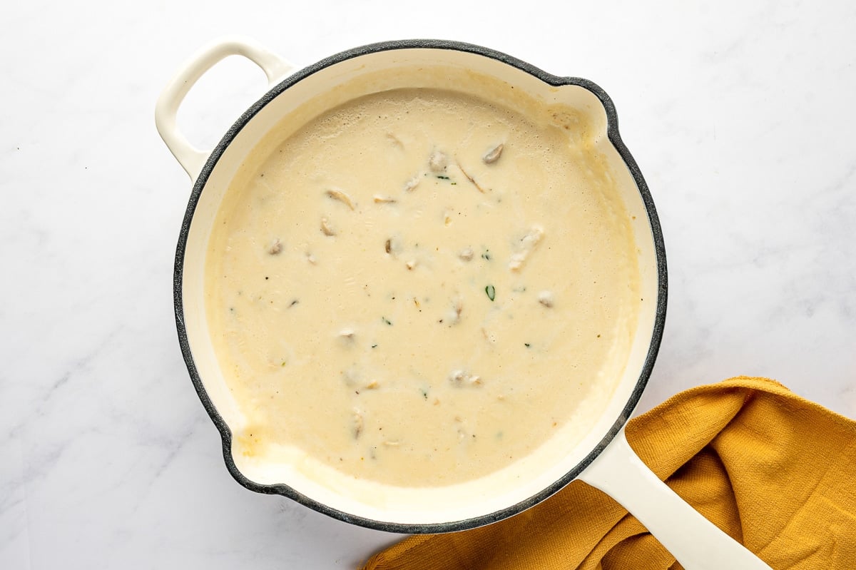 Finished creamy mushroom sauce in a skillet, ready to mix with green beans.