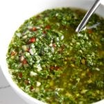 A close up of a bowl Chimichurri